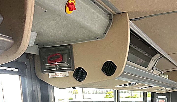 Overhead air vents and individual reading lights above the passenger seats in the Four Season Travel Mini Coach