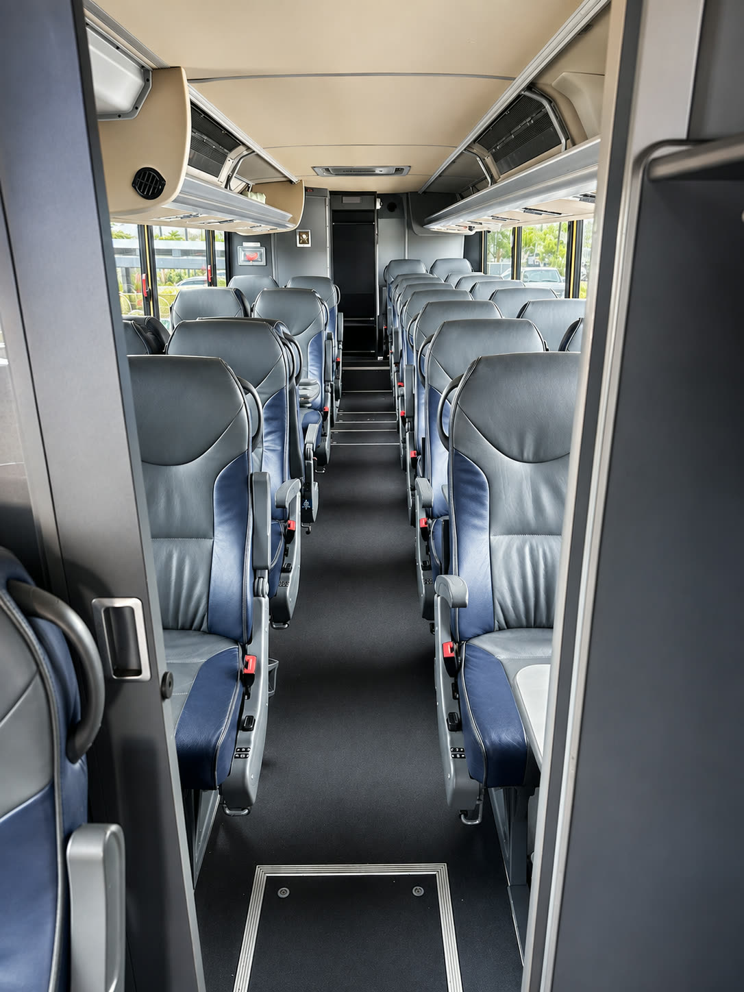 Four Season Travel Mini Coach interior aisle with passenger seating rows