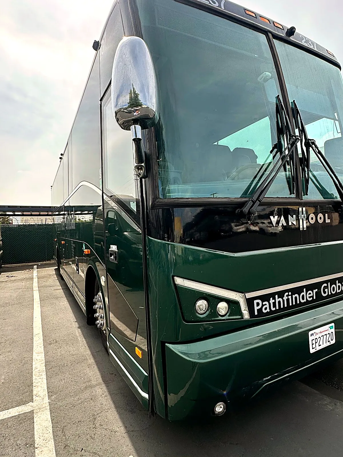 Four Season Travel Mini Coach photographed from the front exterior, showing the full vehicle and passenger entry door