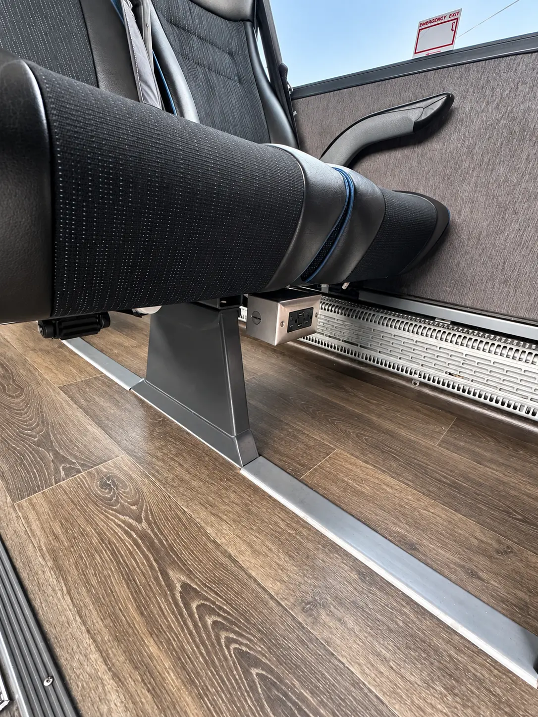 Power outlets at seat level for charging devices onboard the Four Season Travel Mini Coach