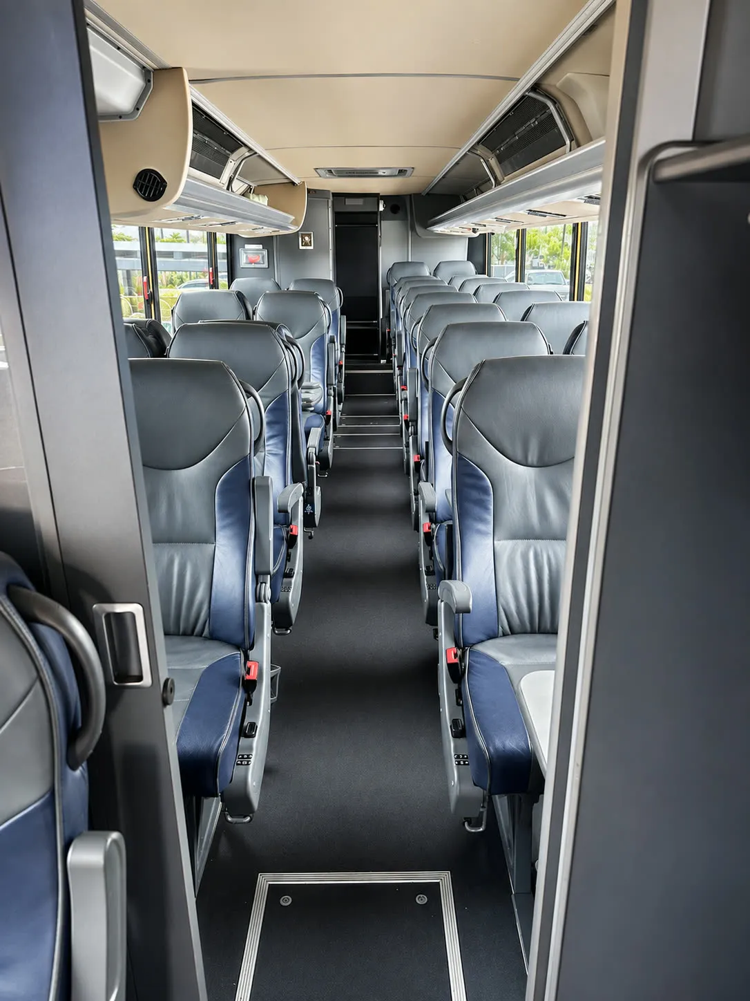 Four Season Travel Mini Coach interior aisle with passenger seating rows